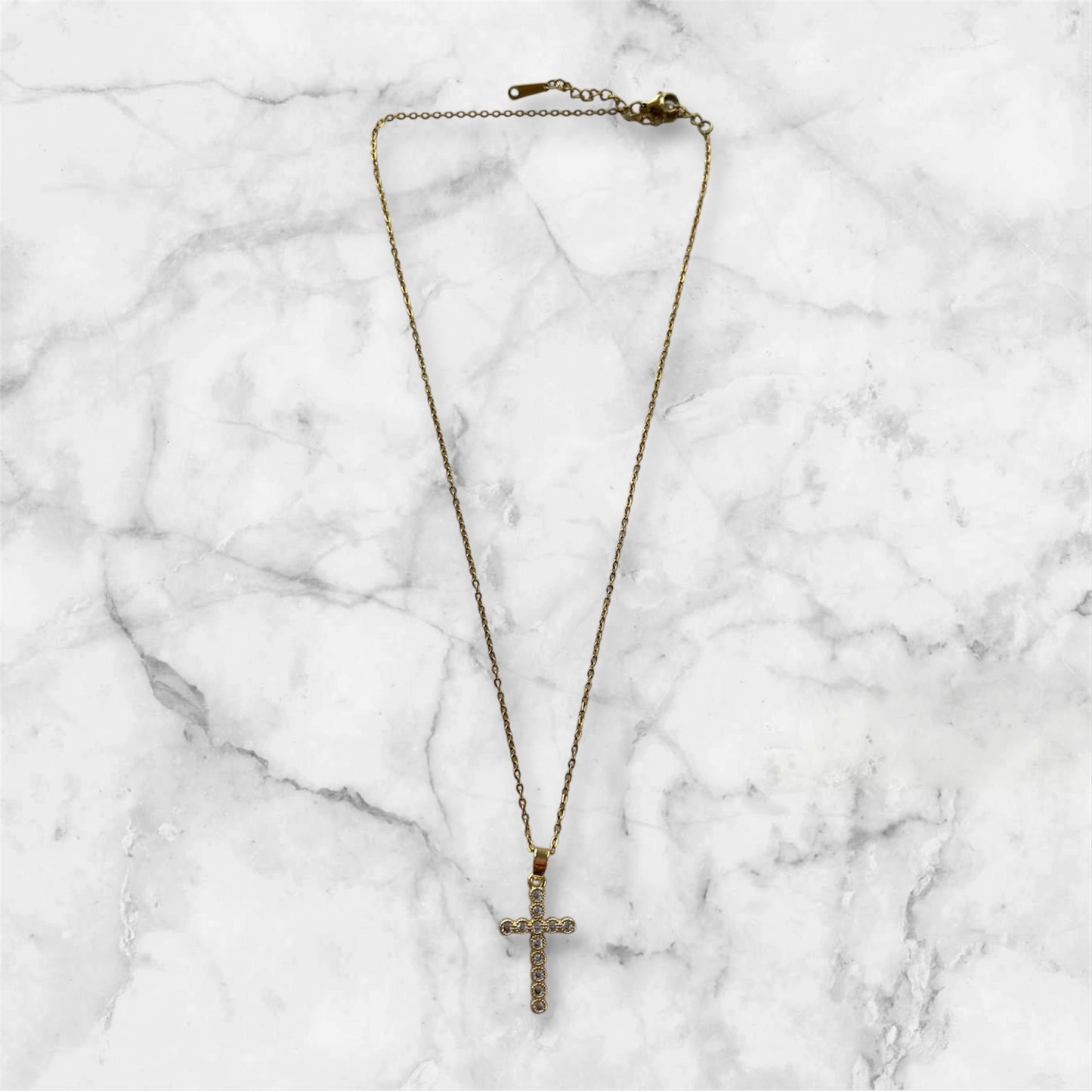 gold cross necklace, zircon stones, rebecca necklace, front image