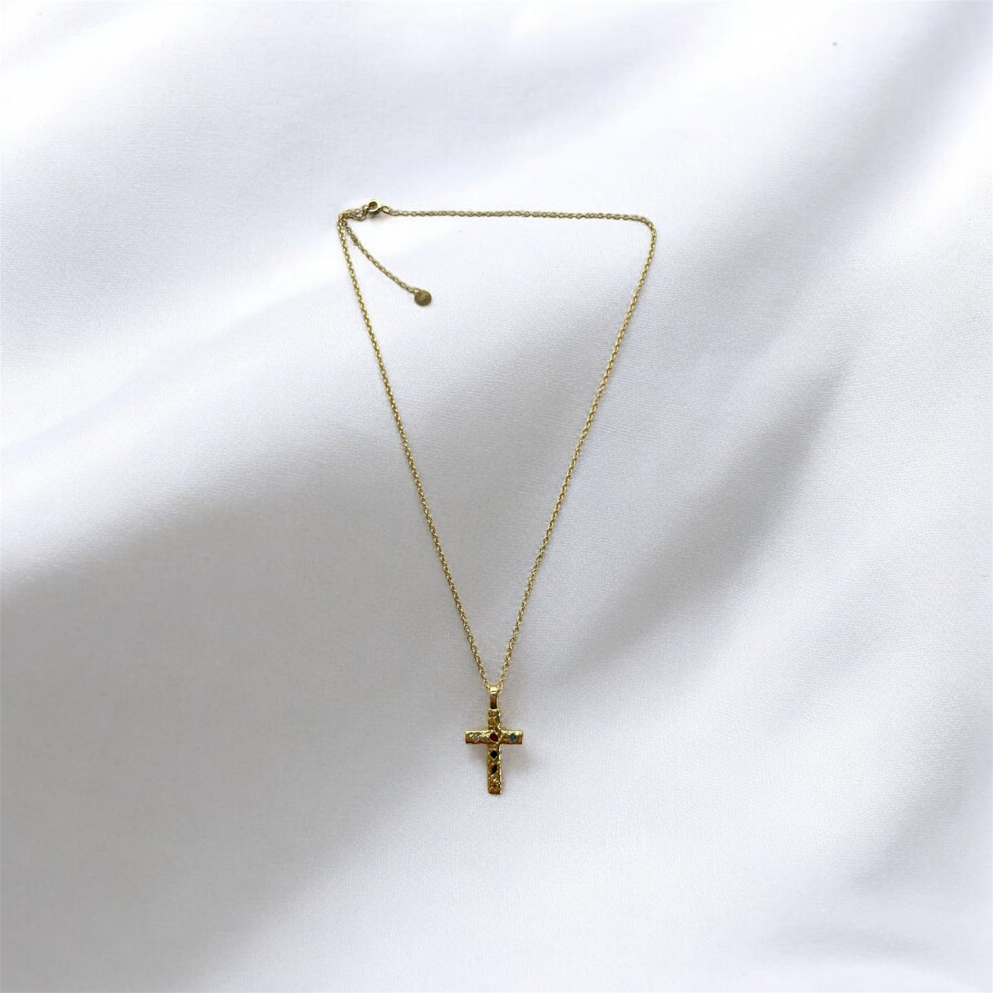 gold cross necklace, gemstones, gold chain, front image